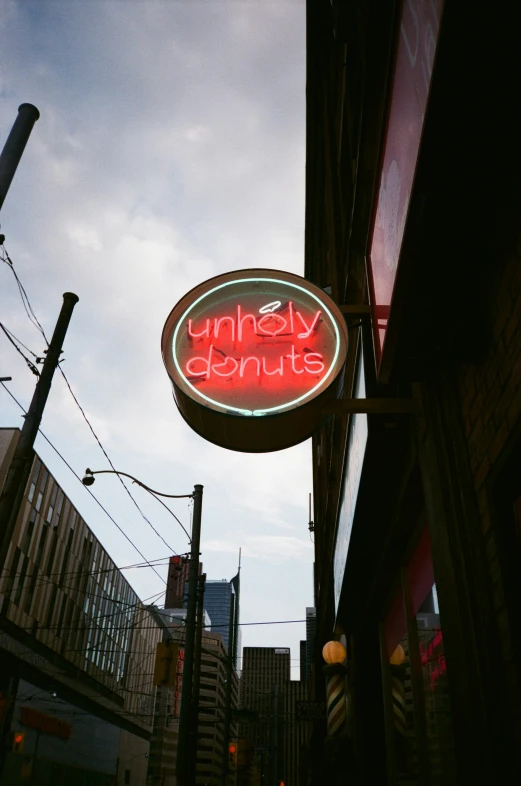 the sign for jimmy tomato hangs high above the road