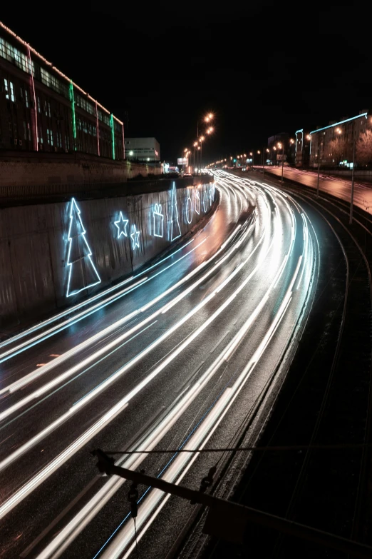 light trails form christmas trees on an interstate