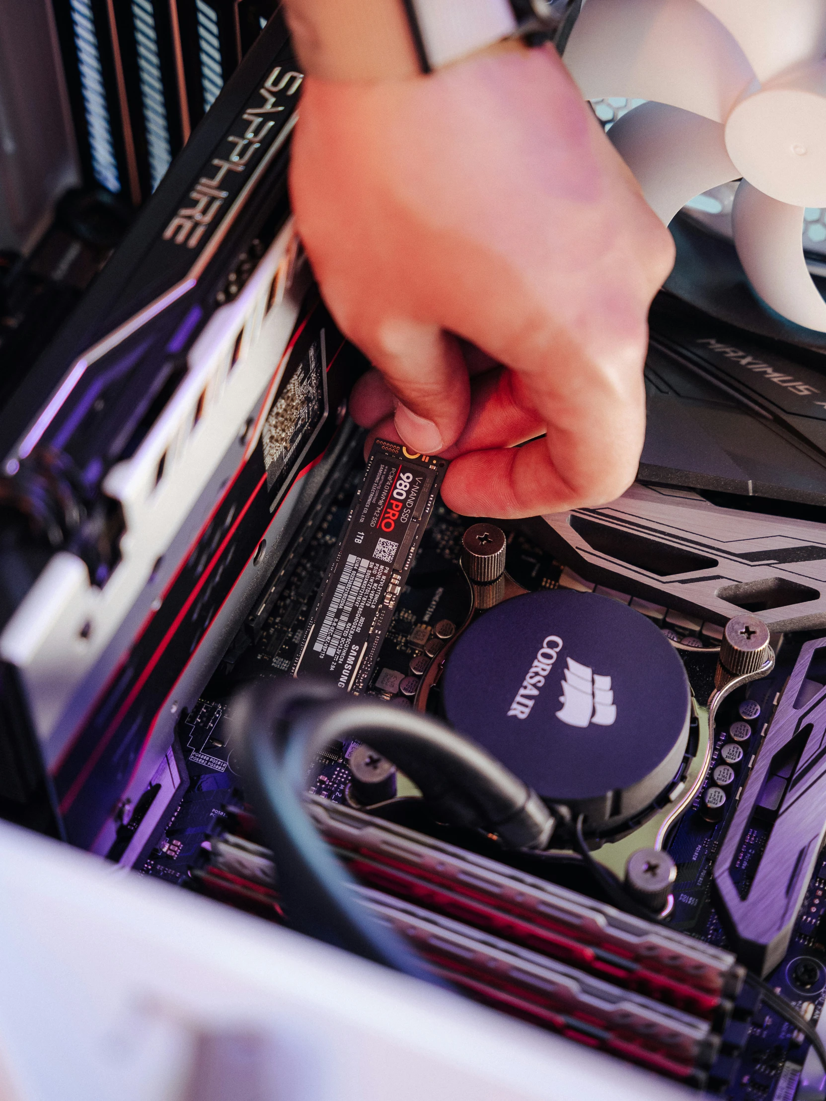 a technician repairs part of a computer in the process of repairing the motherboard