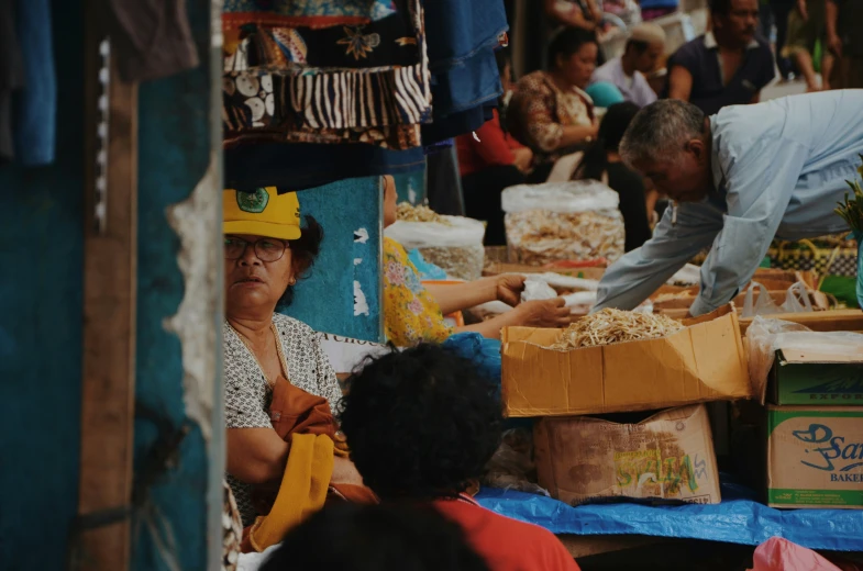 two men working on a display with various items