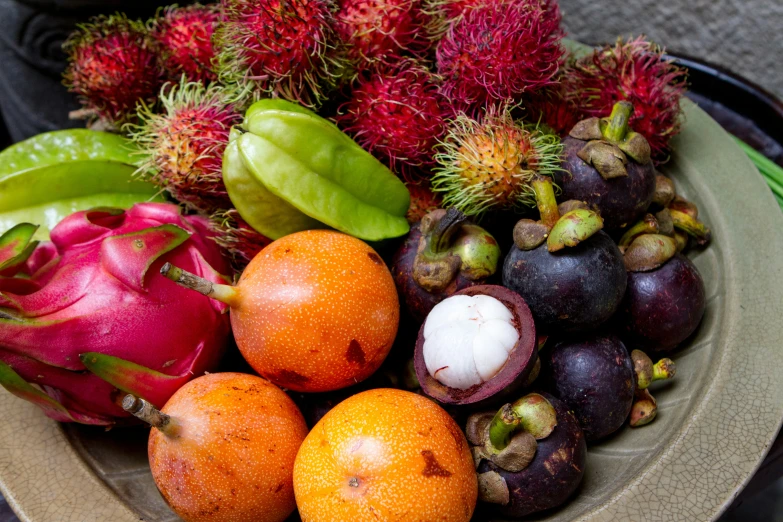 a pile of fruit with many different fruits on it