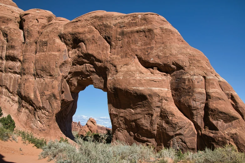 the rocks have been carved into the shape of a large archway