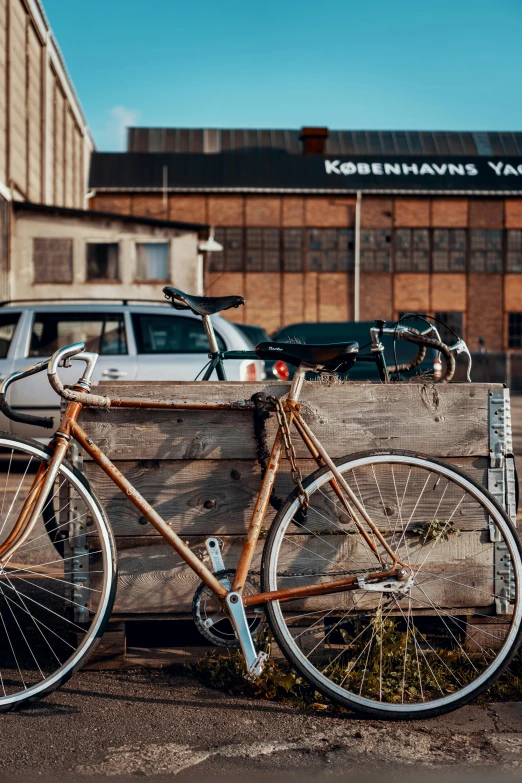 a wooden crate with a bike attached to it