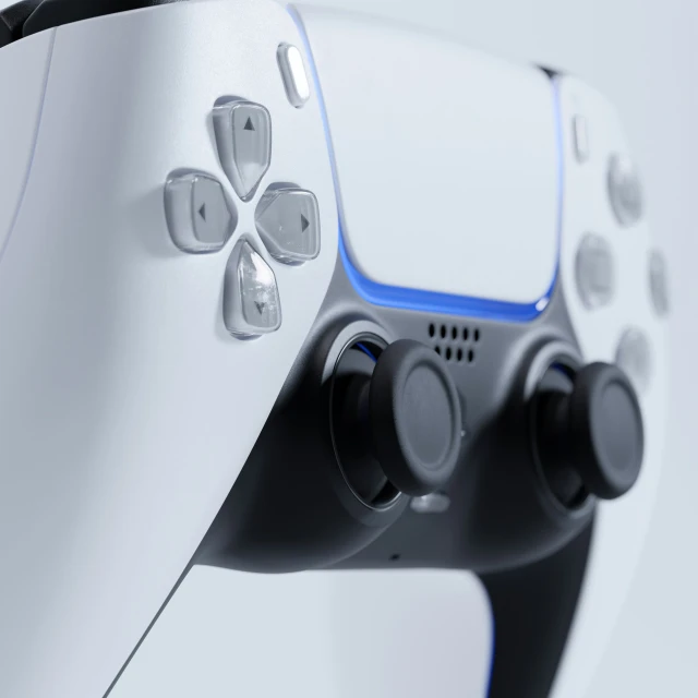 this game controller is white and blue with several black ons