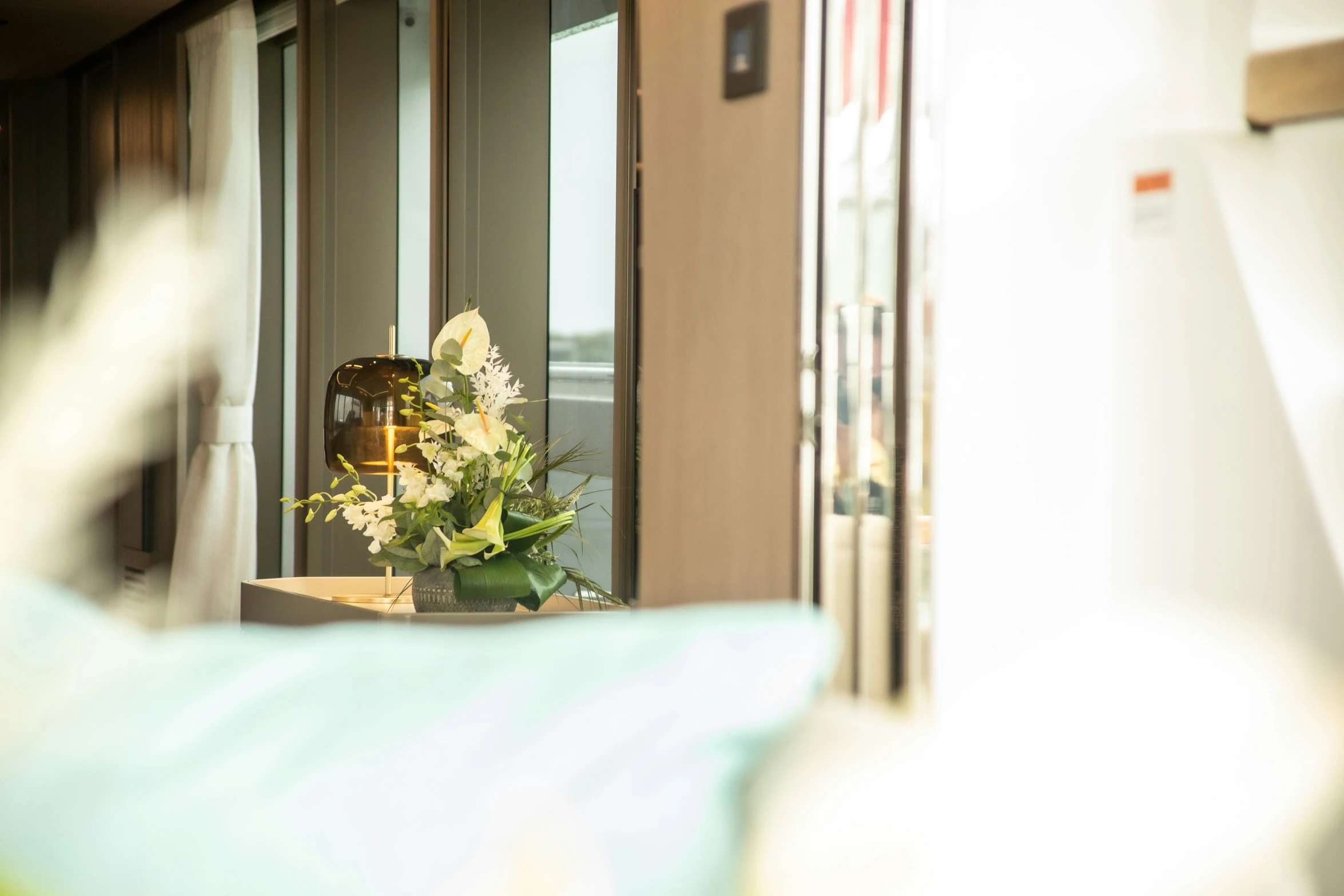 a vase of flowers is sitting on a table