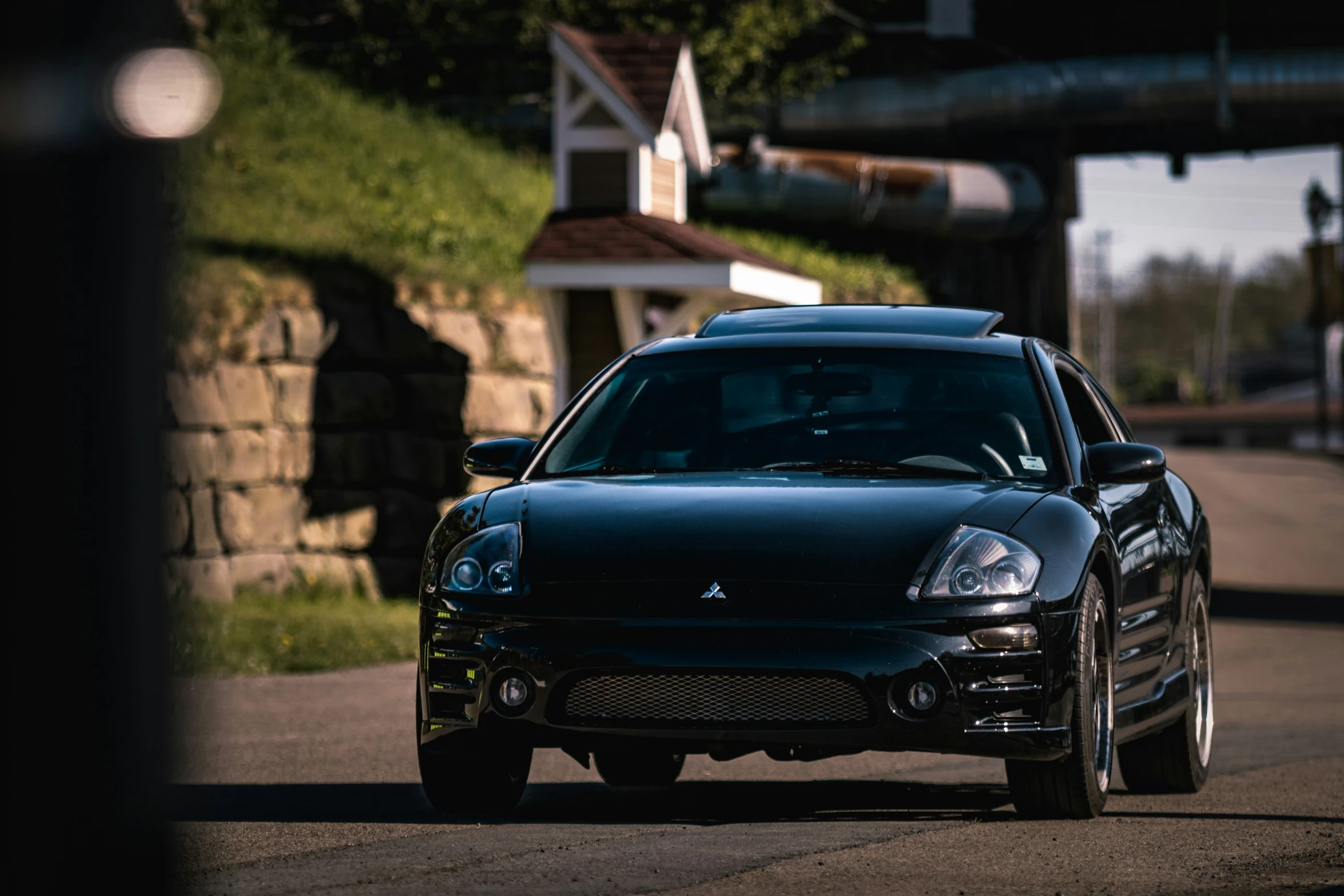 a car on a paved road in the evening