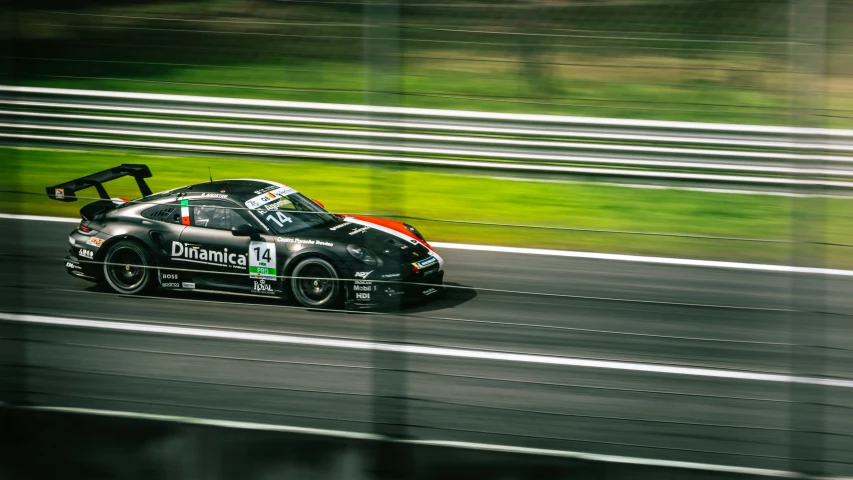 a car driving on a race track with the driver