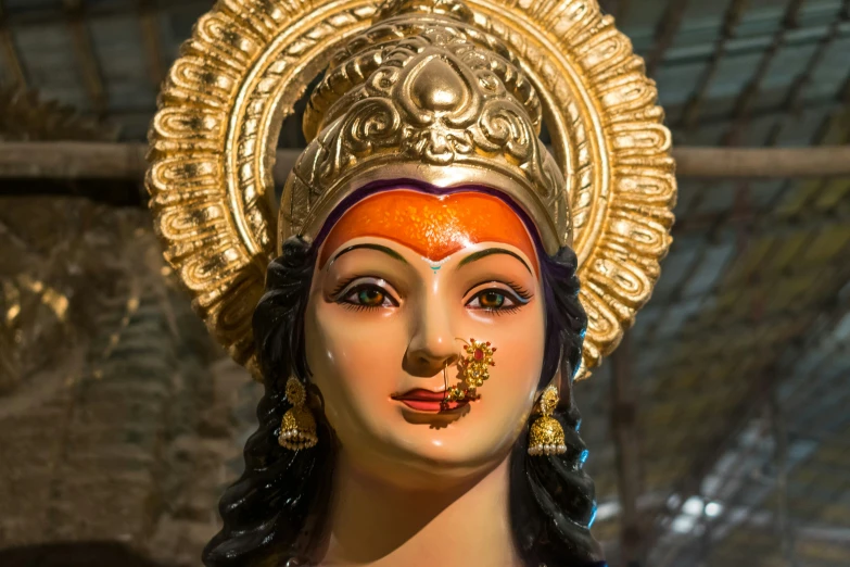 a close up of a statue of the goddess