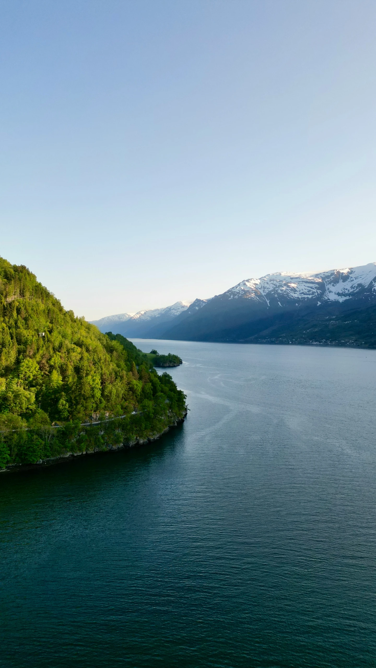 a boat sailing on top of a large body of water