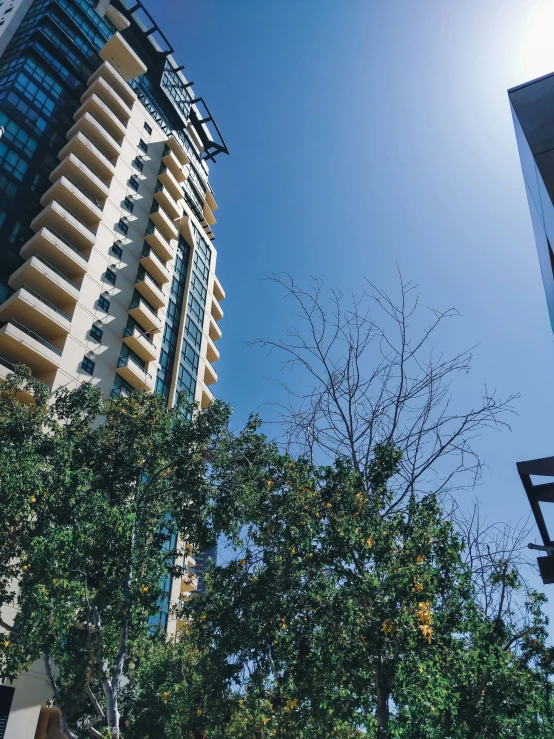 looking up at a skyscr between two buildings