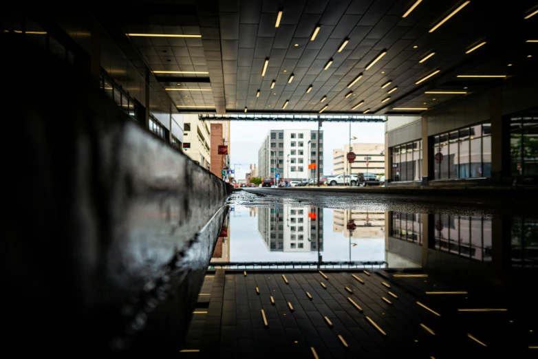 a reflection is shown in the water outside of a building