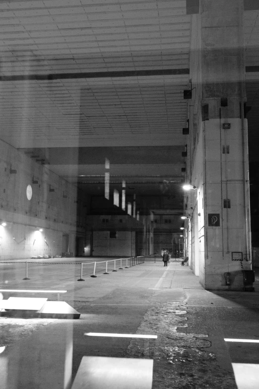 an empty and dirty parking garage at night