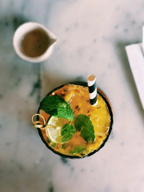 a beverage and two beverages on a marble table