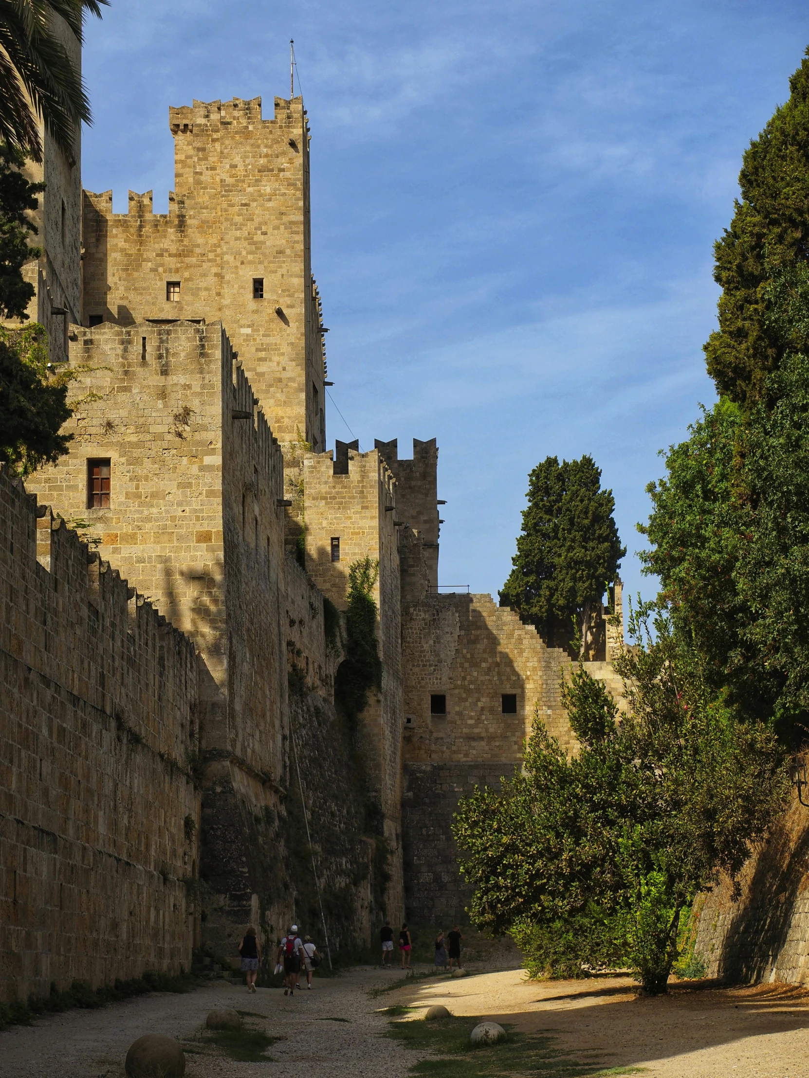 two people stand in front of an old castle