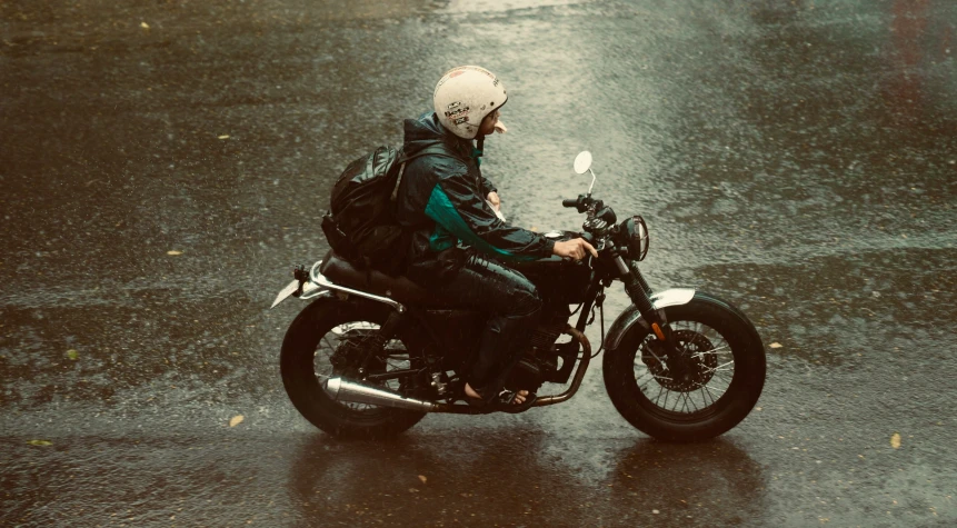 a man is riding on the back of a motorcycle