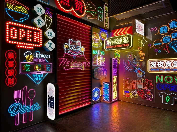 various neon signs line the walls of an event room