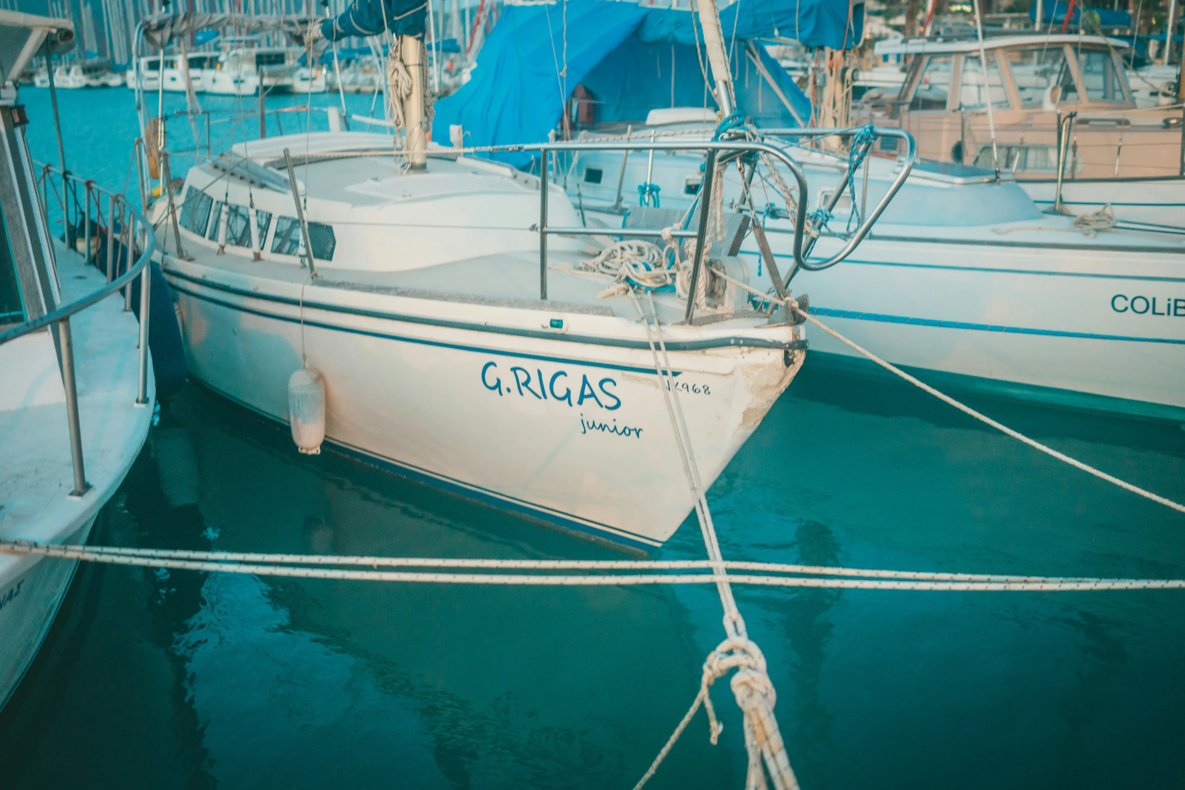 there are several small boats tied up to the dock