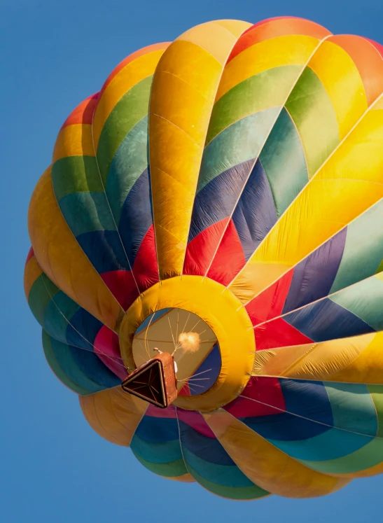 a  air balloon with rainbows on it in the sky