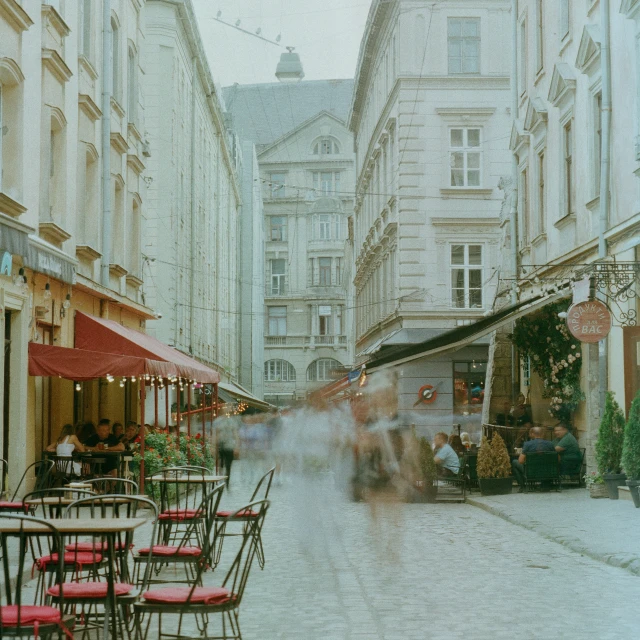 an outdoor dining area in a busy city center