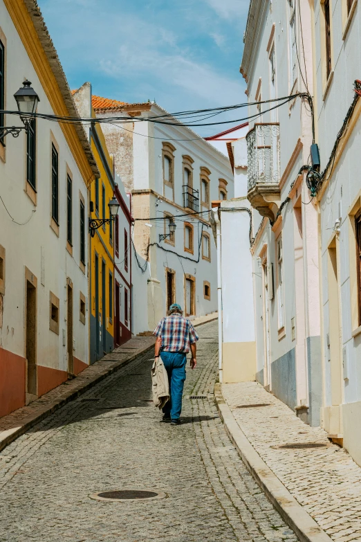 a woman walking down an old city street