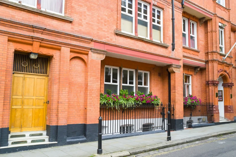 the building is made of bricks and has yellow doors