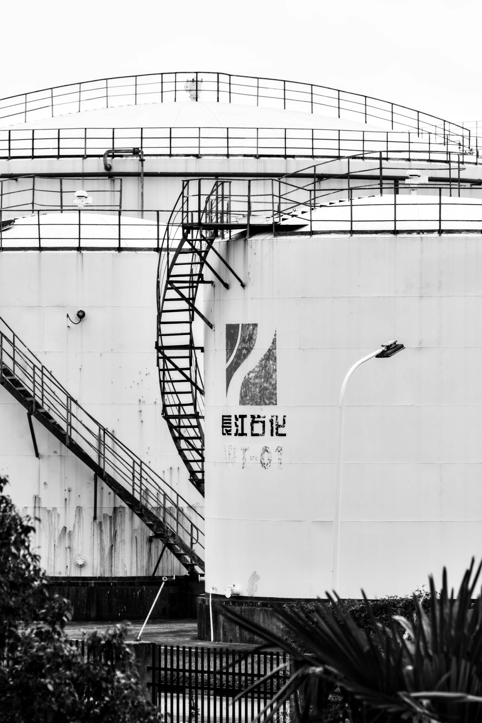 stairs on the side of a large boat with a spiral staircase