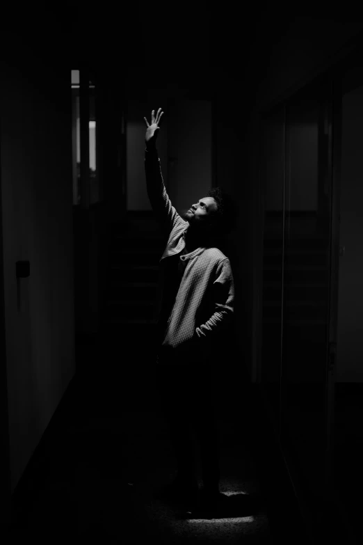 a person standing in a dimly lit room