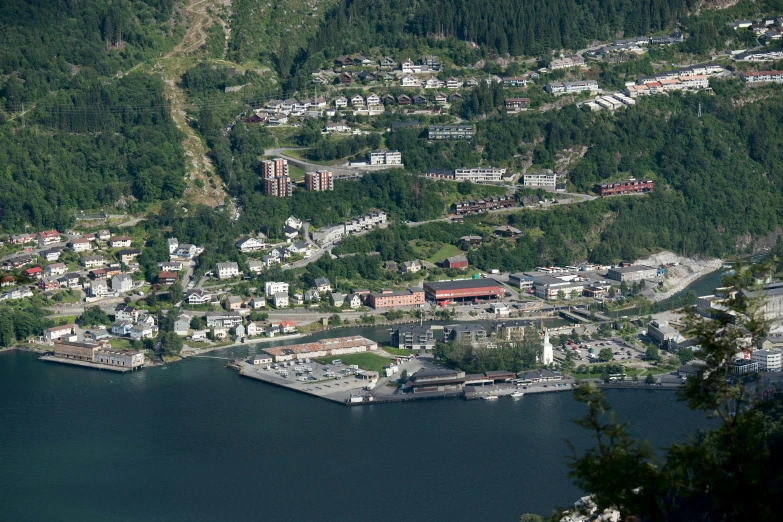 a bird's - eye view of a village that overlooks a large body of water