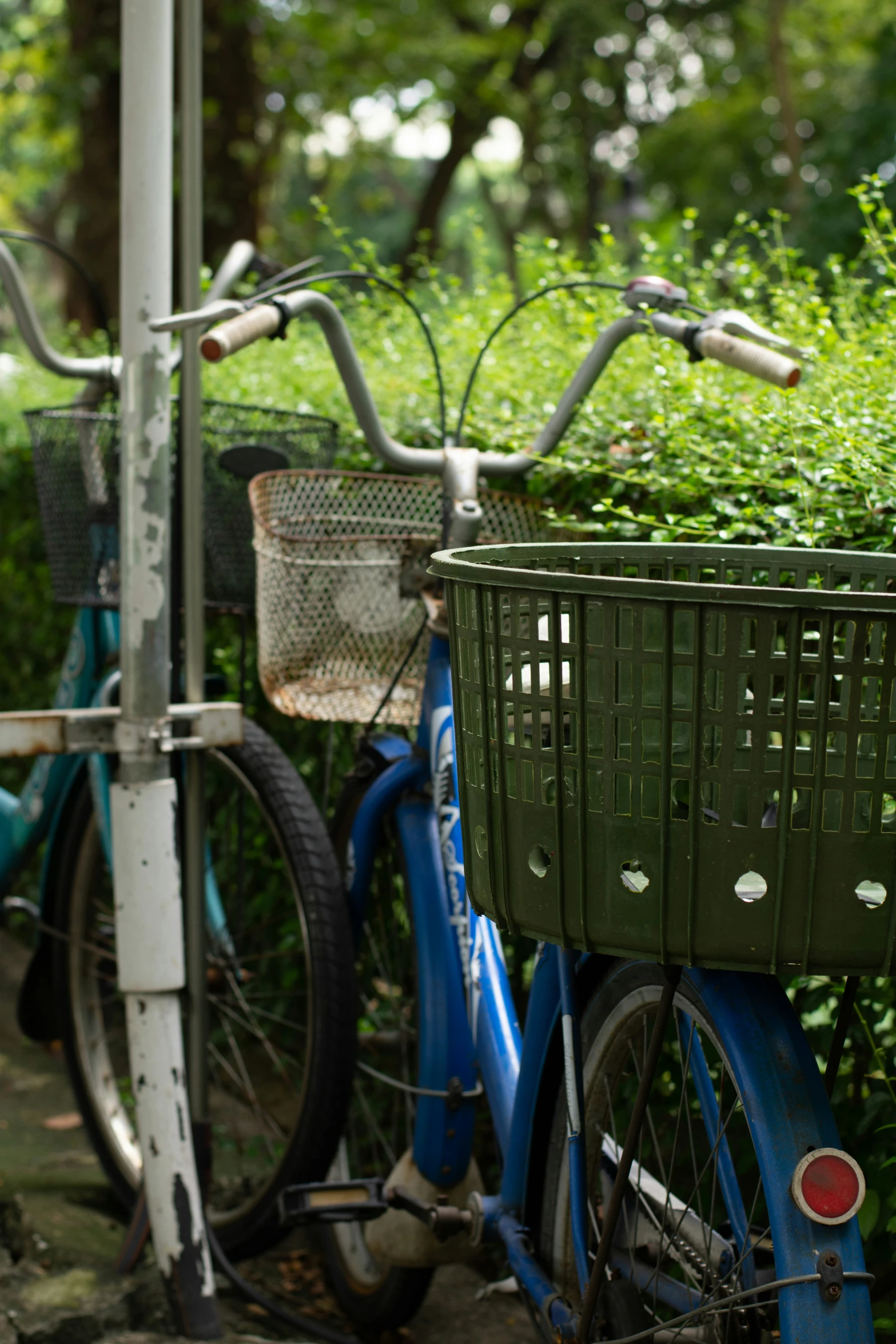 several bicycles are parked outside in a park
