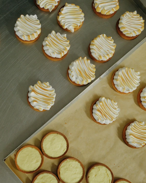 a tray of food with yellow frosting on top