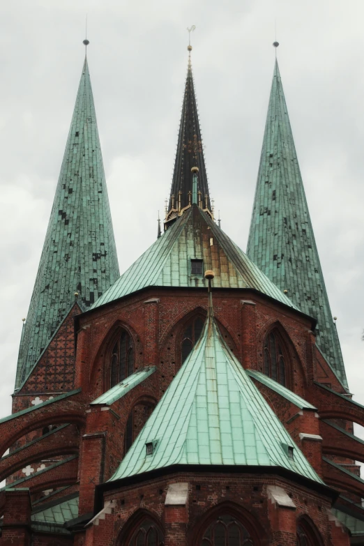 an ornate looking building has steeple towers