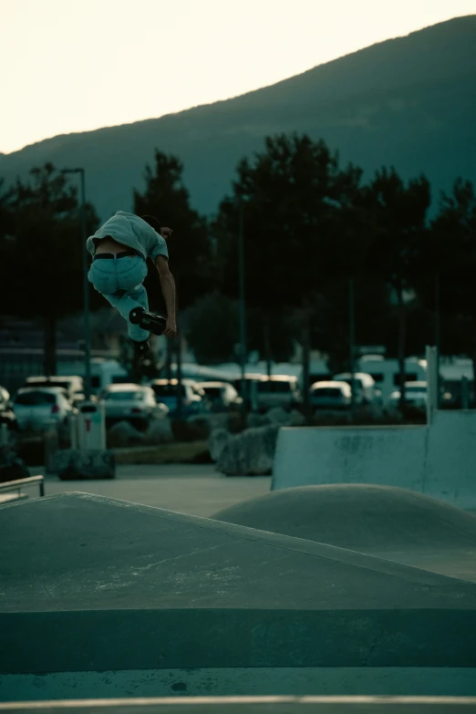 a boy doing tricks on his skateboard in the air