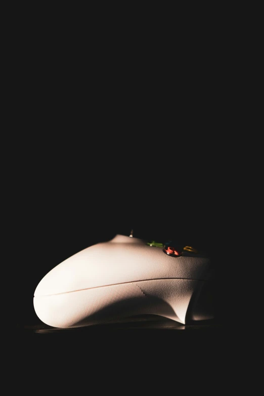 a close up of a computer mouse on a black surface