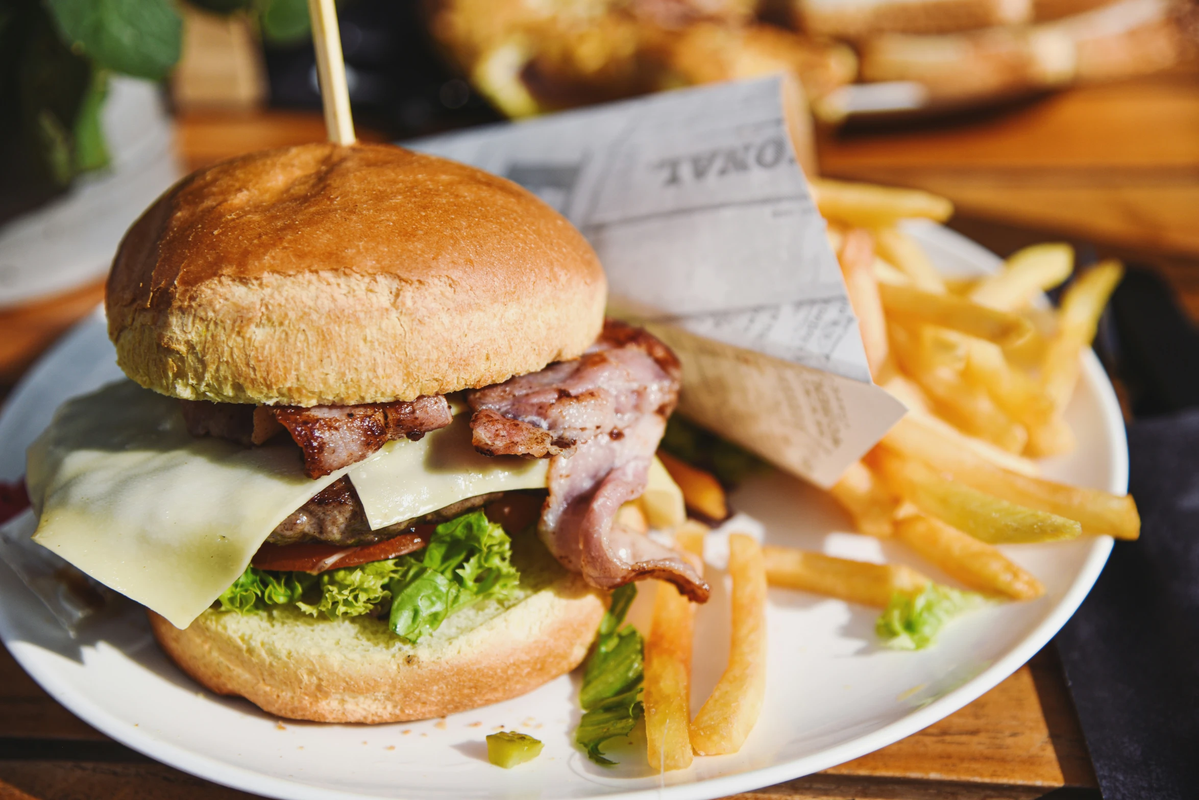 a white plate with a sandwich and fries on it