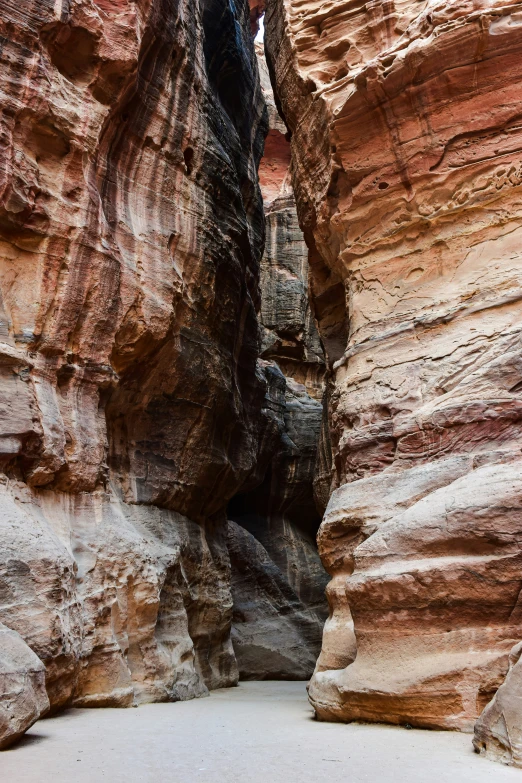 a rocky mountain with thin narrow narrow steps leading up to the bottom