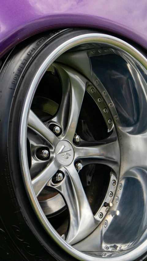 closeup of tire and rim on a purple car