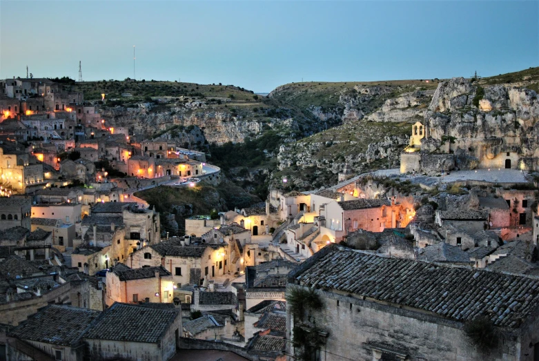 a large group of buildings that are near the mountains