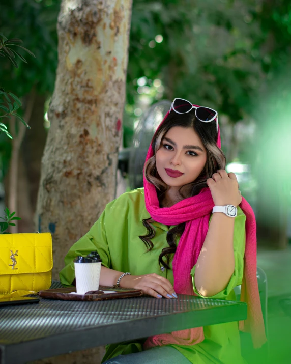 woman sitting on a bench wearing a scarf and a bright scarf