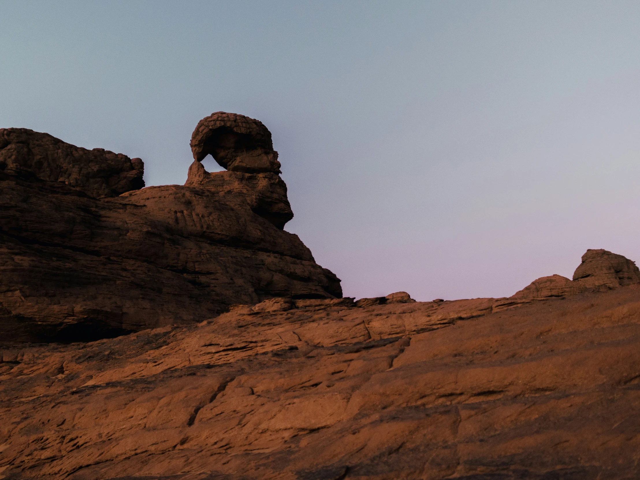 a rock formation with rocks in the background