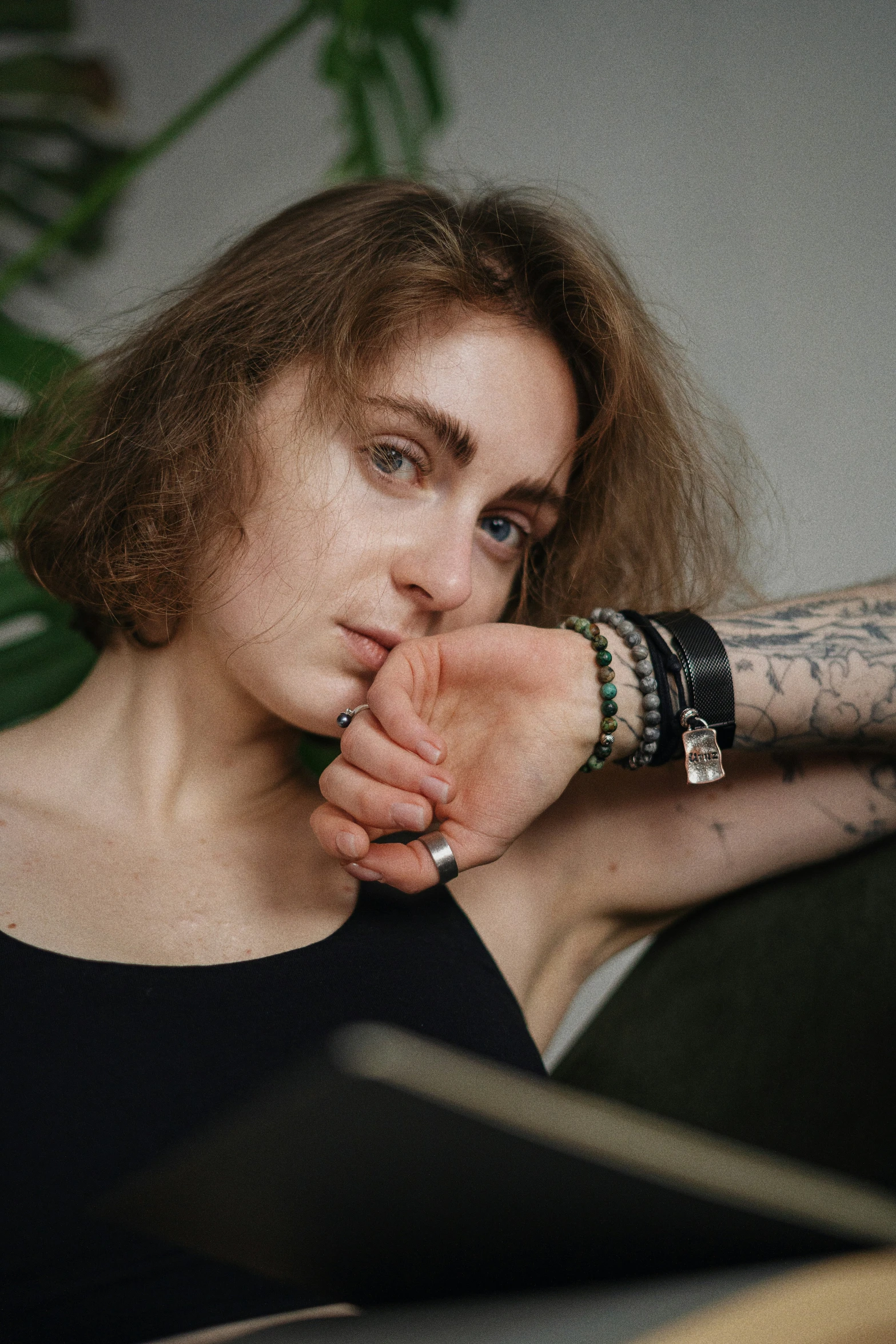 a woman smoking and resting her hand on her face