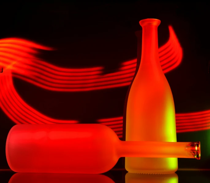 a bottle and its shadow projected in the night light