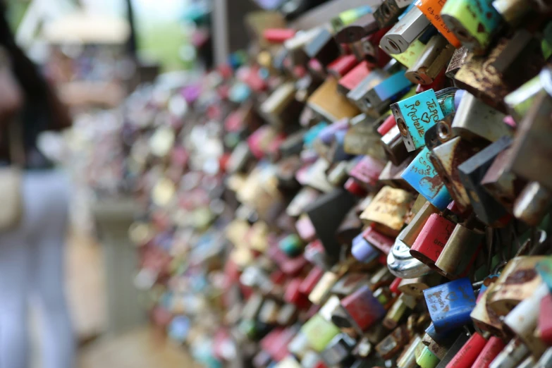 many different colors of love locks attached to the fence