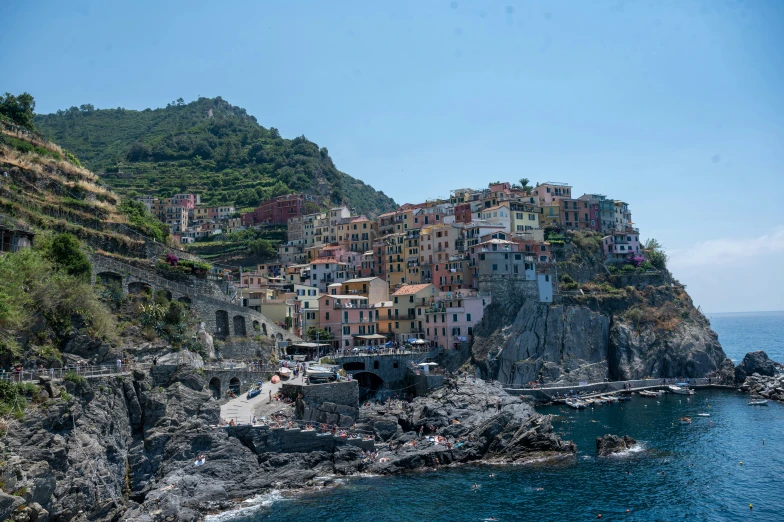 an overview of a town on a coast, overlooking the sea