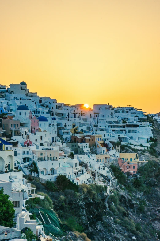 colorful buildings on hillside at sunset in city