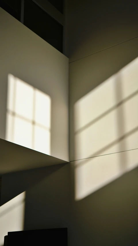 a room with two square windows and one light