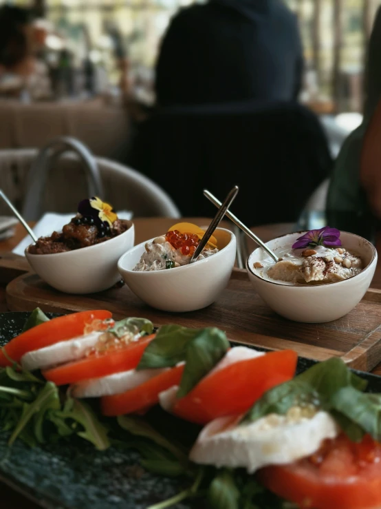 several dishes of food sitting on a table