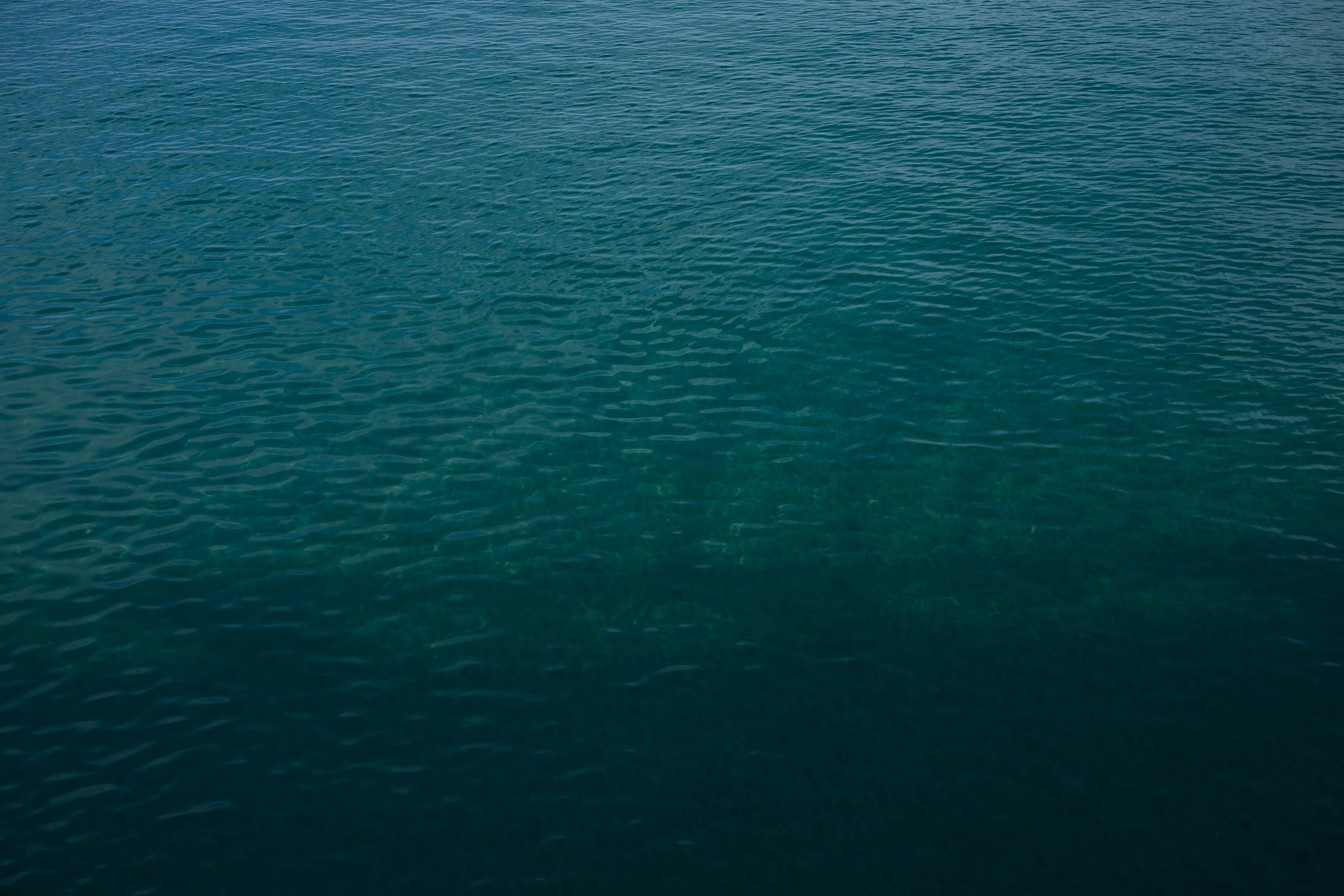 a blue body of water surrounded by land