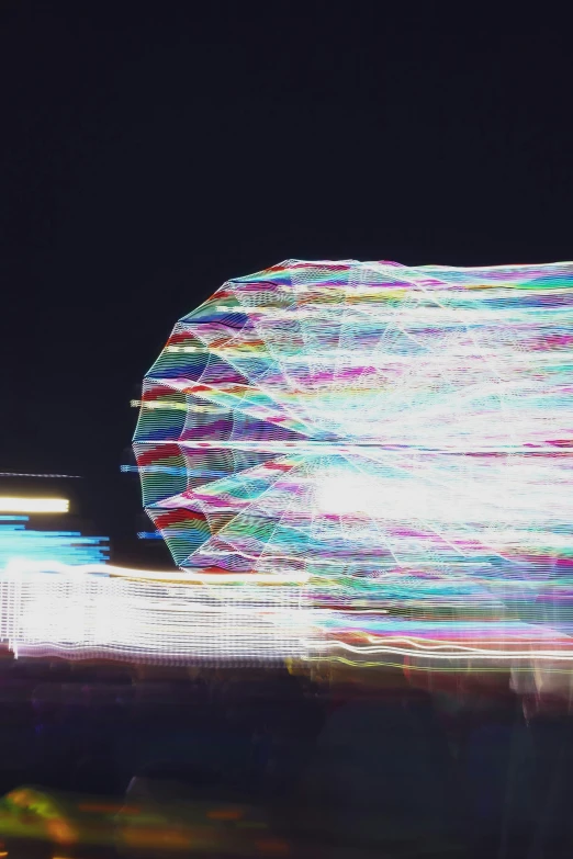 lights and rides in an amut park at night