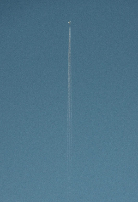 there is an airplane that is flying through the sky