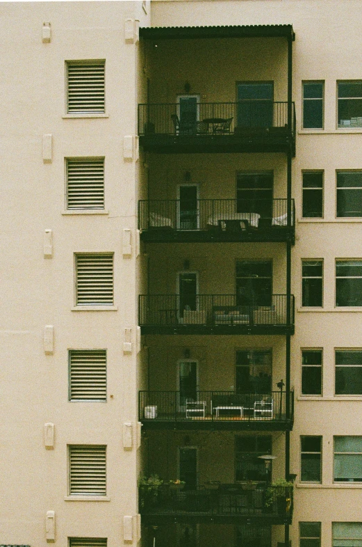 a tall building sitting next to another building